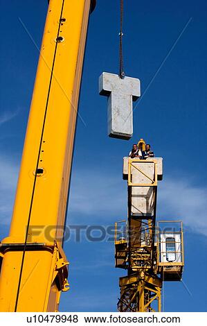 assembly crane lifting cement block counterweights into position View Large Photo Image Stock Photo - assembly crane lifting cement block counterweights into position. Fotosearch