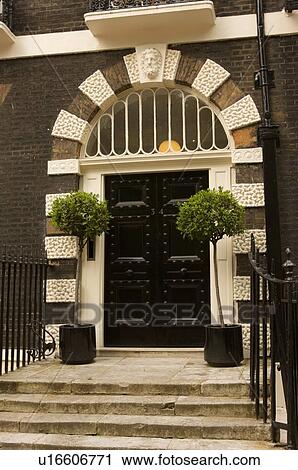 Stock Image - Bedford Square, Bloomsbury, London, detail of black door. Fotosearch