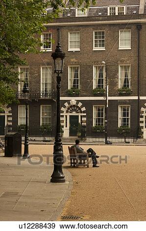 Bedford Square, Bloomsbury, London, view of curving path and houses, with man sitting on bench View Large Photo Image Stock Photo - Bedford Square, Bloomsbury, London, view of curving path and houses, with man sitting on bench. Fotosearch