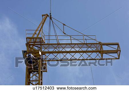 cabin and boom being atached to crane tower by workmen View Large Photo Image Stock Image - cabin and boom being atached to crane tower by workmen. Fotosearch