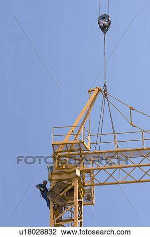 cabin and boom being atached to crane tower by workmen View Large Photo Image Stock Image - cabin and boom being atached to crane tower by workmen. Fotosearch