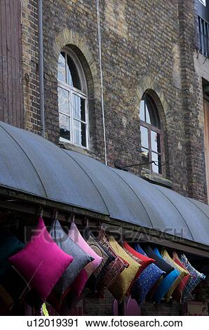 Camden Lock Market, colourful cushions hanging for sale at heritage brick building View Large Photo Image Stock Image - Camden Lock Market, colourful cushions hanging for sale at heritage brick building. Fotosearch