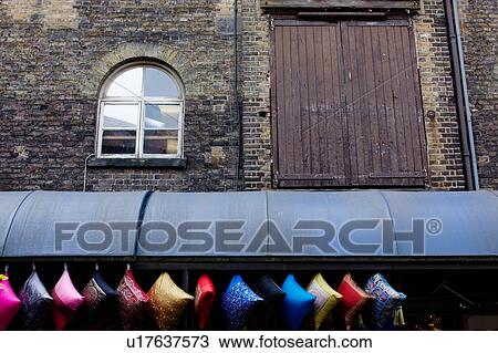 Camden Lock Market, colourful cushions hanging for sale at heritage brick building View Large Photo Image Stock Image - Camden Lock Market, colourful cushions hanging for sale at heritage brick building. Fotosearch