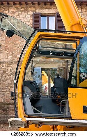 crane cabin in front of stone building, Italy, side view with reflection of crane tower in window View Large Photo Image Stock Photography - crane cabin in front of stone building, Italy, side view with reflection of crane tower in window. Fotosearch