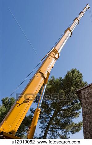 Crane tower pointing skyward View Large Photo Image Stock Image - Crane tower pointing skyward . Fotosearch