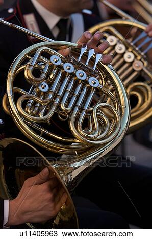 Detail of brass band instruments, with detail of two French horns View Large Photo Image Stock Image - Detail of brass band instruments, with detail of two French horns. Fotosearch