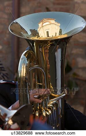 Detail of brass band instruments, with reflection of Italian church in euphonium View Large Photo Image Stock Photo - Detail of brass band instruments, with reflection of Italian church in euphonium. Fotosearch