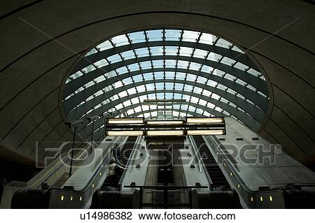 Stock Image - escalators at Canary Wharf tube station. Fotosearch