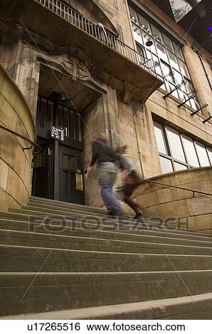 Exterior of Glasgow School of Art, Glasgow, Scotland, designed by Charles Rennie Mackintosh, with students running up stairs View Large Photo Image Stock Photograph - Exterior of Glasgow School of Art, Glasgow, Scotland, designed by Charles Rennie Mackintosh, with students running up stairs. Fotosearch