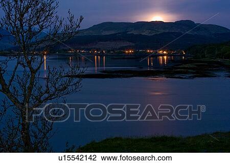 Stock Image - Full moon rising over Salen Bay, Isle of Mull, Scotland. Fotosearch
