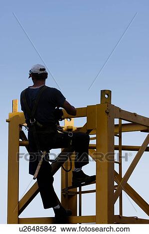 man assembling crane tower segments, climbing View Large Photo Image Stock Image - man assembling crane tower segments, climbing. Fotosearch