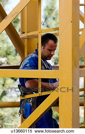 man assembling crane tower segments View Large Photo Image Stock Photography - man assembling crane tower segments . Fotosearch