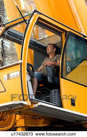 man operating crane from cabin, side view View Large Photo Image Stock Image - man operating crane from cabin, side view . Fotosearch