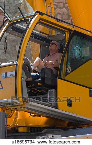 man operating crane in cabin View Large Photo Image Picture - man operating crane in cabin . Fotosearch