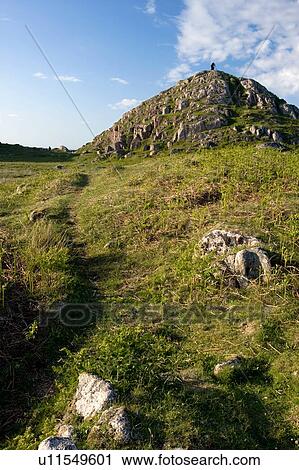 path leading to hilly mound near Kintra, Isle of Mull, Scotland, with figure at top in distance View Large Photo Image Stock Image - path leading to hilly mound near Kintra, Isle of Mull, Scotland, with figure at top in distance. Fotosearch