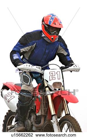 Single motocross rider riding along dirt ridge, close up, front view View Large Photo Image Stock Image - Single motocross rider riding along dirt ridge, close up, front view. Fotosearch