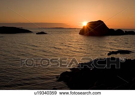 Sunset over bay at Kintra Isle of Mull, Scotland, View Large Photo Image Stock Photo - Sunset over bay at Kintra Isle of Mull, Scotland, . Fotosearch