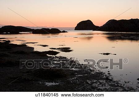 Sunset over bay of Kintra, Isle of Mull, Scotland, reflected in tidal pools View Large Photo Image Stock Photography - Sunset over bay of Kintra, Isle of Mull, Scotland, reflected in tidal pools. Fotosearch