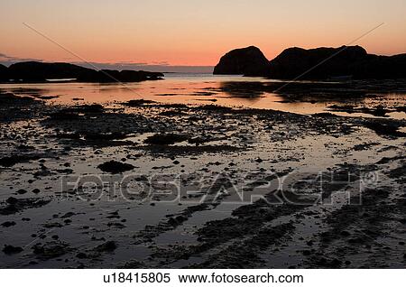 Sunset over bay of Kintra, Isle of Mull, Scotland, reflected in tidal pools View Large Photo Image Stock Photography - Sunset over bay of Kintra, Isle of Mull, Scotland, reflected in tidal pools. Fotosearch