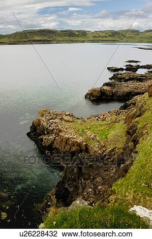 Stock Image - View from cliffs at Calgary bay on late sunny afternoon in spring. Fotosearch