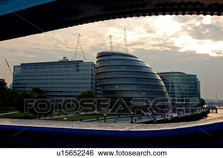 View of London skyline from Tower Bridge at sunset, showing City Hall complex View Large Photo Image Stock Photograph - View of London skyline from Tower Bridge at sunset, showing City Hall complex. Fotosearch