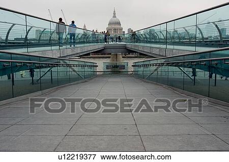 View of Millenium Bridge from south bank of River Thames, with dome of St Paul's Cathedral in background View Large Photo Image Stock Photo - View of Millenium Bridge from south bank of River Thames, with dome of St Paul's Cathedral in background. Fotosearch