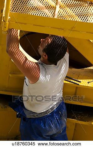 workman checking attachment point on crane boom on ground, closeup View Large Photo Image Stock Photography - workman checking attachment point on crane boom on ground, closeup . Fotosearch