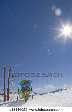 Stock Photo - Girl sitting in sunshine. Fotosearch