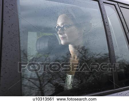Stock Image - Woman in a car. Fotosearch