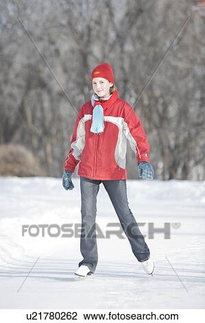 Stock Image - 13 year old girl skating, The Forks, Winnipeg, Canada. Fotosearch