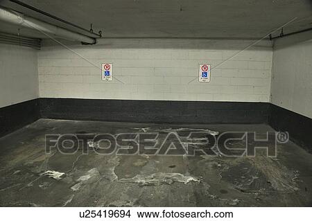 2 disabled parking spots in an underground parking garage, Toronto View Large Photo Image Picture - 2 disabled parking spots in an underground parking garage, Toronto. Fotosearch