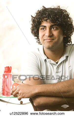 20 year old man holding organic apple, Brandon, Manitoba, Canada View Large Photo Image Stock Photograph - 20 year old man holding organic apple, Brandon, Manitoba, Canada. Fotosearch