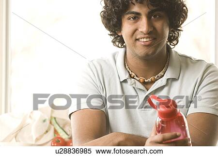 20 year-old man holding refillable water bottle, Brandon, Manitoba, Canada View Large Photo Image Stock Photography - 20 year-old man holding refillable water bottle, Brandon, Manitoba, Canada. Fotosearch