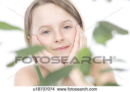 9 year old girl with the green leafs around her View Large Photo Image Picture - 9 year old girl with the green leafs around her. Fotosearch