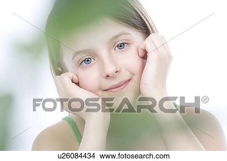 9 year old girl with the green leafs around her View Large Photo Image Picture - 9 year old girl with the green leafs around her. Fotosearch