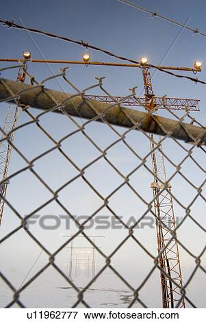 Airport approach towers and chain link fence, Victoria International Airport near Sidney, BC, Canada View Large Photo Image Stock Photo - Airport approach towers and chain link fence, Victoria International Airport near Sidney, BC, Canada. Fotosearch