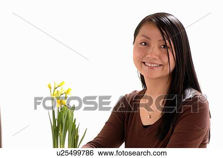 Asian Young girl w/Flower, Regina, Saskatchewan View Large Photo Image Stock Photograph - Asian Young girl w/Flower, Regina, Saskatchewan. Fotosearch