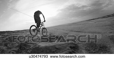 Black and white, youth on mountain bike on prairie terrain; Canada, Alberta, Calgary View Large Photo Image Stock Image - Black and white, youth on mountain bike on prairie terrain; Canada, Alberta, Calgary. Fotosearch