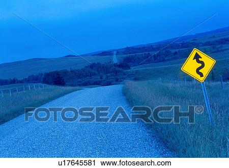 Blue toned winding rural road with bright yellow road sign, Canada, Alberta View Large Photo Image Stock Image - Blue toned winding rural road with bright yellow road sign, Canada, Alberta. Fotosearch