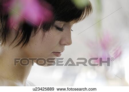 Cactus flower blurred in foregroundof portrait of young woman, Canada, Manitoba, Brandon View Large Photo Image Stock Photo - Cactus flower blurred in foregroundof portrait of young woman, Canada, Manitoba, Brandon. Fotosearch