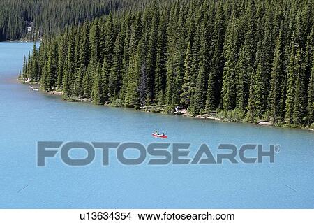 Picture - Canoeing in Moraine Lake, Banff National Park, Alberta. Fotosearch