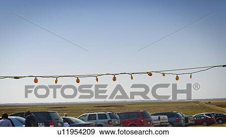Stock Photo - Cars parked beside corn maze, just outside Regina, Saskatchewan. Fotosearch