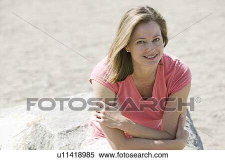Stock Photography - Caucasian Woman at the beach. Sunset Beach, Vancouver, BC. Fotosearch