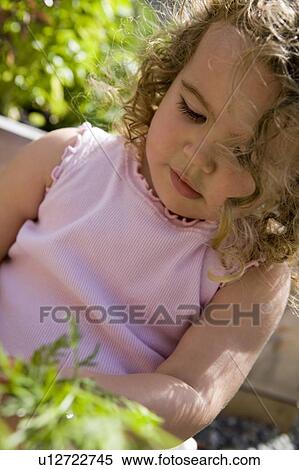Child (female 2. 5 years) in the garden, North Vancouver, BC View Large Photo Image Stock Photography - Child (female 2. 5 years) in the garden, North Vancouver, BC. Fotosearch