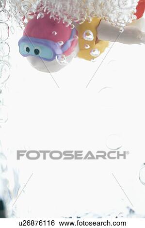 Child's bathtub toy in glass of water View Large Photo Image Stock Photograph - Child's bathtub toy in glass of water. Fotosearch