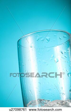 Clear glass containing ice chips View Large Photo Image Stock Image - Clear glass containing ice chips. Fotosearch