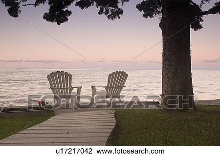 Stock Image - Cottage chair at Lake Manitoba, Canada. Fotosearch