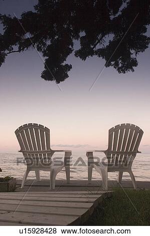 Stock Photo - Cottage chair at Lake Manitoba, Canada. Fotosearch