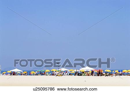 Stock Photograph - Crowded Copa Cabana beach area. Fotosearch