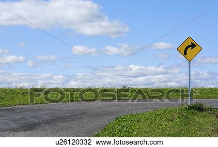 Curve ahead sign on country road. View Large Photo Image Stock Image - Curve ahead sign on country road.. Fotosearch
